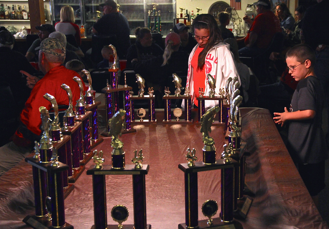 Kids admiring the trophies at the rules meeting/tournament dinner the night before the tournament.