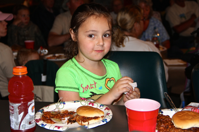 A young participant enjoying the tournament dinner.
