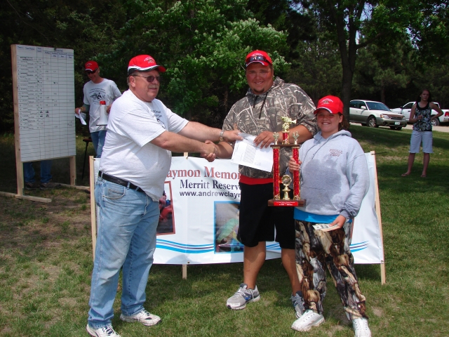 Steve Isom, representing the Nebraska Walleye Association (NWA), and presenting the 1st place winners in the 10 and under age group with a $100.00 check from NWA and a free entry to their Oct. 2011 tournament at Merritt.