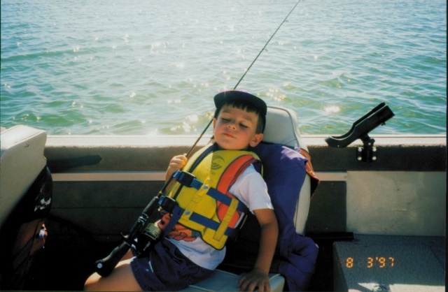 Andrew waiting in the boat for more fishing! or maybe hes asleep..